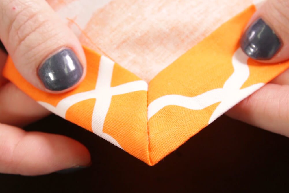 How to Sew a Fabric Napkin - Step 4: Sew the mitered corners