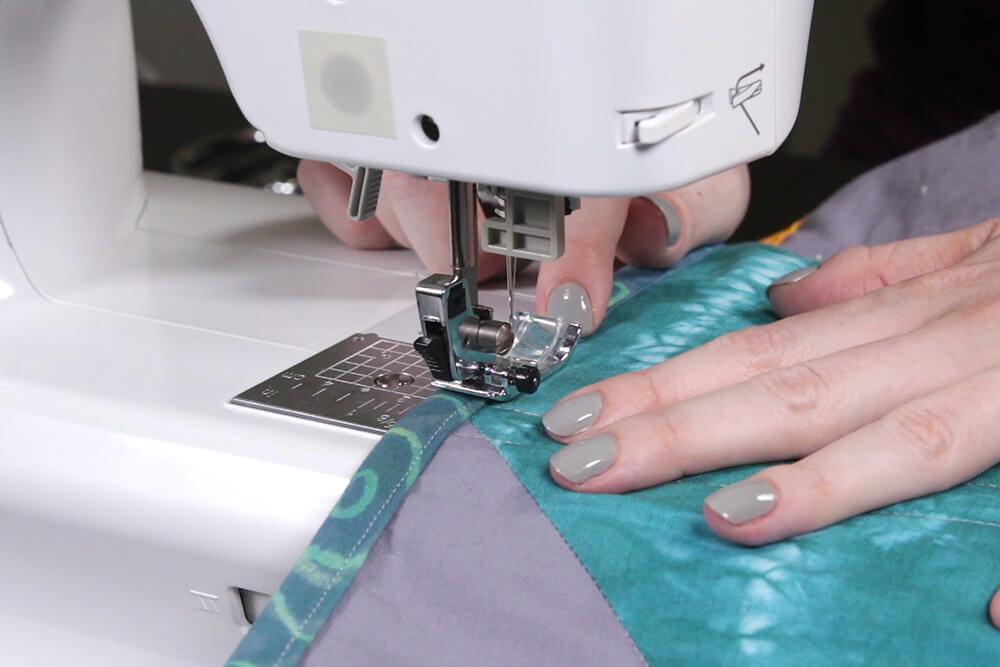 How to Make a Herringbone Quilt - Finish sewing binding